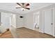 Bright bedroom features hardwood floors, ceiling fan, and access to an en-suite bathroom at 5037 Laurel Springs Se Way, Smyrna, GA 30082