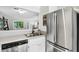 Modern kitchen featuring stainless steel appliances, ample counter space, and a view into the dining area at 5037 Laurel Springs Se Way, Smyrna, GA 30082