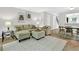Inviting living room featuring a comfortable sectional sofa, stylish decor, and natural light at 5037 Laurel Springs Se Way, Smyrna, GA 30082