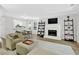 Open-concept living room with fireplace, adjacent dining area and lots of natural light at 5037 Laurel Springs Se Way, Smyrna, GA 30082