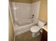 Full bathroom features a tub and shower combination and a standard white toilet at 6231 Redan Overlook, Lithonia, GA 30058