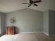 Empty bedroom showcasing vaulted ceiling and a cabinet perfect for storage at 6231 Redan Overlook, Lithonia, GA 30058