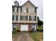Charming townhome with a one-car garage and tidy front yard at 6231 Redan Overlook, Lithonia, GA 30058