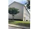Charming multi-level townhouse with manicured lawn, tree, and neutral siding, located in a desirable neighborhood at 6231 Redan Overlook, Lithonia, GA 30058