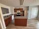 Functional kitchen featuring an island, stainless steel refrigerator, and plenty of cabinet storage at 6231 Redan Overlook, Lithonia, GA 30058