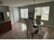 Bright kitchen with a chandelier, stainless steel appliances and natural light at 6231 Redan Overlook, Lithonia, GA 30058