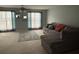 Inviting living area with cozy gray sectional and natural light at 6231 Redan Overlook, Lithonia, GA 30058