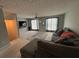 Comfortable living room with a large sectional sofa and plush carpeting at 6231 Redan Overlook, Lithonia, GA 30058