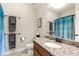 Bathroom showcasing granite countertop, vanity, and modern fixtures and decor at 5830 Caveat Ct, Suwanee, GA 30024