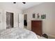 Bedroom offering neutral colors, ceiling fan, and access to additional rooms at 5830 Caveat Ct, Suwanee, GA 30024