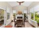 The bright dining room features a vaulted ceiling, fireplace, hardwood floors and windows for natural light at 5830 Caveat Ct, Suwanee, GA 30024