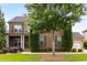Charming brick home featuring manicured lawn and meticulously maintained landscaping at 5830 Caveat Ct, Suwanee, GA 30024