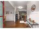 Spacious foyer with hardwood flooring and decorative wall art at 5830 Caveat Ct, Suwanee, GA 30024
