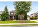 Charming brick home with well-maintained landscaping, mature trees, and inviting curb appeal at 5830 Caveat Ct, Suwanee, GA 30024