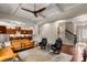 The living room features hardwood floors, a coffered ceiling, and an open layout into the kitchen at 5830 Caveat Ct, Suwanee, GA 30024