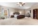 Expansive bedroom boasts natural light, neutral tones, and ample space for relaxation and exercise at 5830 Caveat Ct, Suwanee, GA 30024