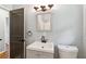 Updated bathroom with a sleek vanity, modern faucet, and neutral wall color for a clean aesthetic at 4653 Ridgewood Dr, Forest Park, GA 30297