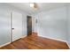 Spacious bedroom with hardwood floors and neutral walls, offering a blank canvas for personalization at 4653 Ridgewood Dr, Forest Park, GA 30297