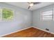 Sunlit bedroom with hardwood floors and large windows creating a bright and airy atmosphere at 4653 Ridgewood Dr, Forest Park, GA 30297