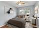 Stylishly furnished bedroom with a comfortable bed, desk, and modern decor creating a cozy atmosphere at 4653 Ridgewood Dr, Forest Park, GA 30297