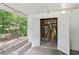 View of the storage room with white doors and some outdoor access at 4653 Ridgewood Dr, Forest Park, GA 30297