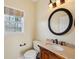 Charming powder room with decorative tile and fixtures at 5615 Toccoa Dr, Douglasville, GA 30135