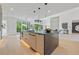 Spacious kitchen with a large island with seating, modern appliances, and open layout to living room at 292 Highway 279, Fayetteville, GA 30214