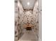 Modern walk-in shower with geometric tile, frameless glass door, and mosaic tile floor at 1380 Wayne Ne Ave, Atlanta, GA 30306