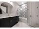 Stylish bathroom boasting a modern vanity with a marble countertop and honeycomb tile shower at 1380 Wayne Ne Ave, Atlanta, GA 30306