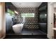 Modern bathroom showcasing a soaking tub, glass-enclosed shower, and stylish tile work at 1380 Wayne Ne Ave, Atlanta, GA 30306