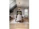 Modern dining area with designer chandelier, seating for six, and hardwood floors at 1380 Wayne Ne Ave, Atlanta, GA 30306