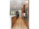 Spacious kitchen with wood cabinets, stainless steel double ovens, and hardwood floors at 1380 Wayne Ne Ave, Atlanta, GA 30306