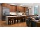 Modern kitchen featuring wood cabinetry, stainless steel appliances, and a marble-top island at 1380 Wayne Ne Ave, Atlanta, GA 30306