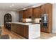 Modern kitchen featuring wood cabinets, stainless steel appliances, and a large marble island at 1380 Wayne Ne Ave, Atlanta, GA 30306