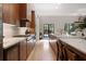 Contemporary kitchen with wood cabinets, marble countertops, and open layout to the dining area at 1380 Wayne Ne Ave, Atlanta, GA 30306