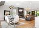 Comfortable living room with fireplace, large TV, and open to dining area at 1380 Wayne Ne Ave, Atlanta, GA 30306