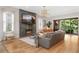 Cozy living room with modern fireplace, large windows, and hardwood floors at 1380 Wayne Ne Ave, Atlanta, GA 30306