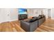 Bright living room with hardwood floors, media center, and comfortable leather seating at 1380 Wayne Ne Ave, Atlanta, GA 30306