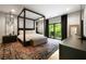 Bedroom with four-poster bed, balcony, and modern decor at 1380 Wayne Ne Ave, Atlanta, GA 30306