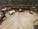 Wooden back deck with grill, chairs, and a wooded view at 2517 Oak Valley Ln, Dacula, GA 30019