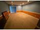 A basement with blue and orange painted walls and tan carpet at 2517 Oak Valley Ln, Dacula, GA 30019