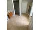 Bright bathroom boasting tiled floors, a wooden vanity, and a separate toilet room for added privacy at 2517 Oak Valley Ln, Dacula, GA 30019