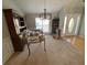 A spacious dining room with carpet flooring and modern chandelier at 2517 Oak Valley Ln, Dacula, GA 30019