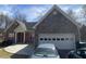 Charming stone front home with attached two car garage and long driveway at 2517 Oak Valley Ln, Dacula, GA 30019