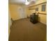 Spacious laundry area featuring a modern dryer, carpeted floors, and overhead lighting for added convenience at 2517 Oak Valley Ln, Dacula, GA 30019