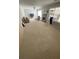Spacious living room featuring fireplace, neutral carpet, and ample natural light at 2517 Oak Valley Ln, Dacula, GA 30019