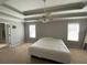 A serene bedroom with tray ceiling, neutral paint, and plenty of sunlight at 2517 Oak Valley Ln, Dacula, GA 30019