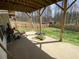 Concrete patio with a wooden fence and trees in the background at 2517 Oak Valley Ln, Dacula, GA 30019