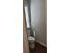 This bathroom features a modern toilet with a window at 5669 Avonley Creek Dr, Sugar Hill, GA 30518