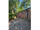 A stone patio area extends to the rear of the red brick home at 2875 Monterey Dr, Decatur, GA 30032